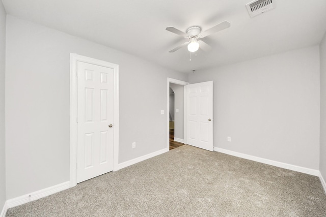 unfurnished bedroom with carpet floors and ceiling fan