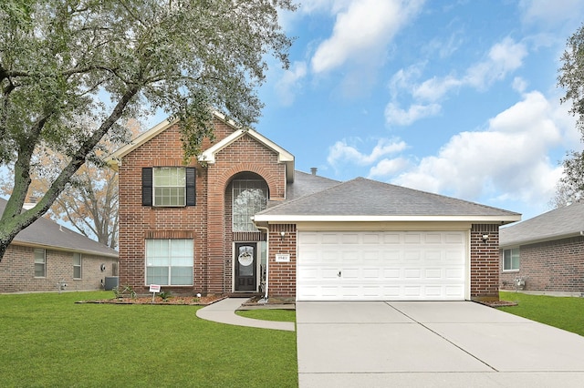 view of front facade with a garage, a front yard, and central AC unit