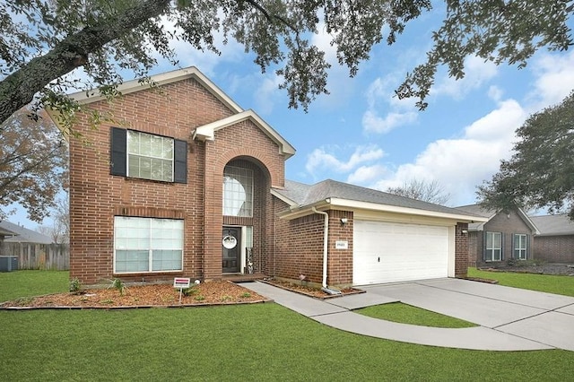 view of property with a garage and a front yard