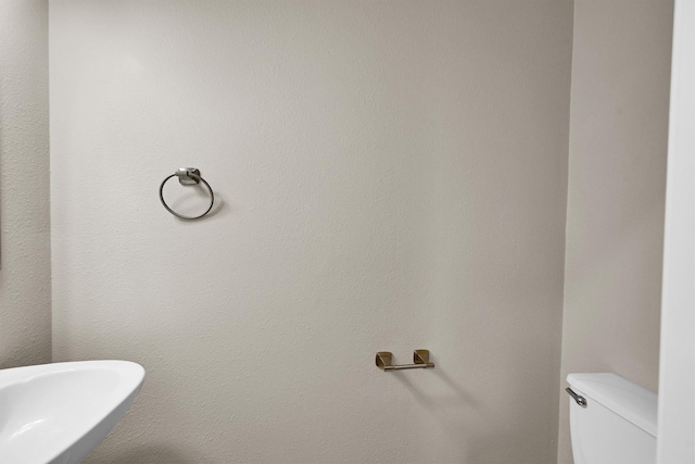 bathroom featuring toilet