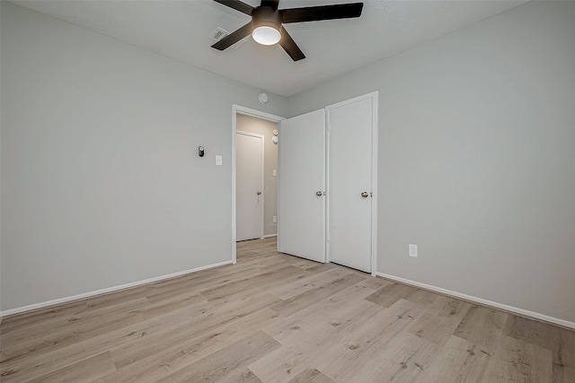 unfurnished bedroom with light hardwood / wood-style floors and ceiling fan