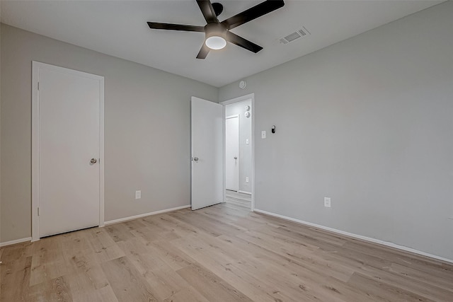 unfurnished bedroom with ceiling fan and light hardwood / wood-style flooring