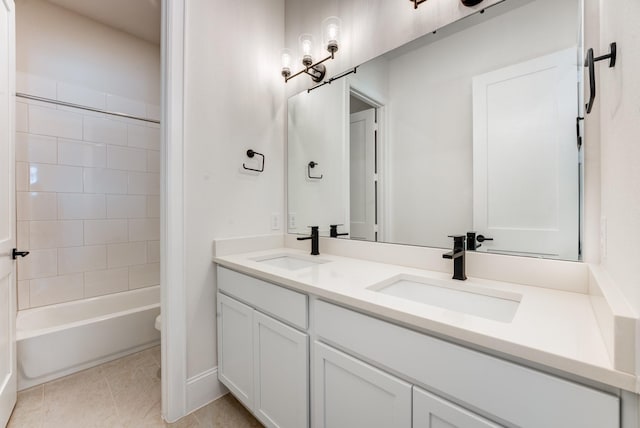 full bathroom featuring tiled shower / bath combo, vanity, tile patterned flooring, and toilet