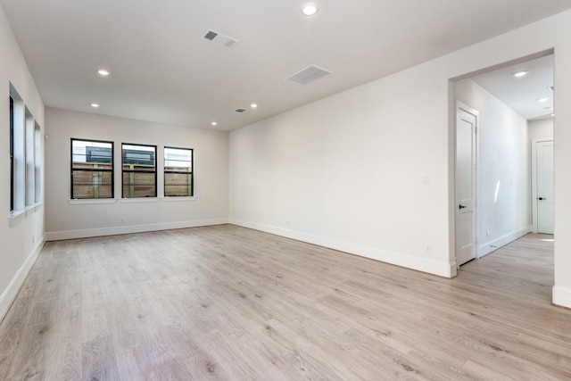 spare room with light wood-type flooring