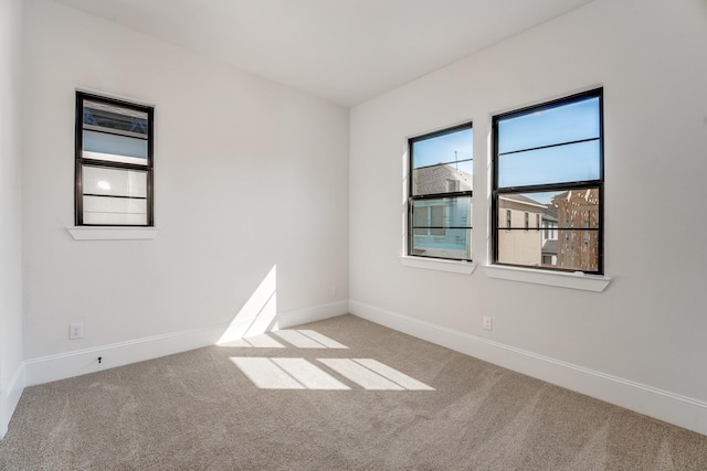 empty room featuring light carpet