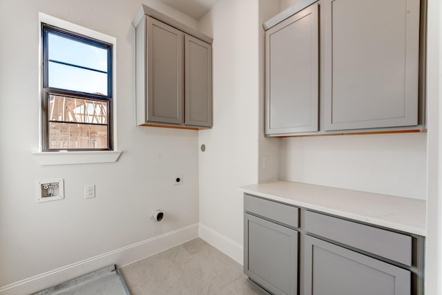 laundry area featuring cabinets, electric dryer hookup, and hookup for a washing machine