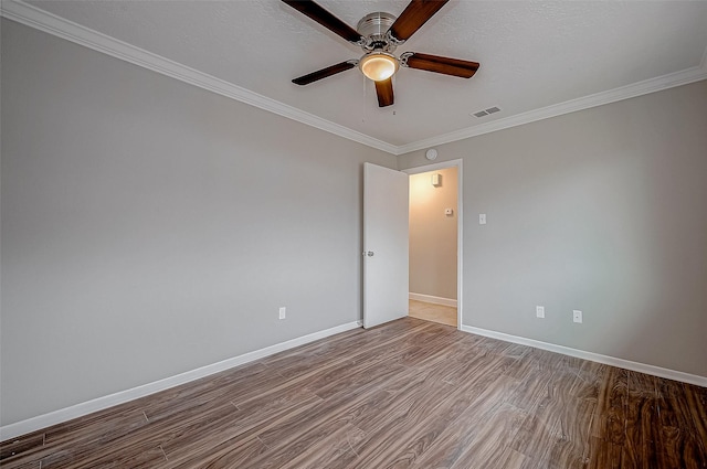 unfurnished room with crown molding, a textured ceiling, ceiling fan, and light hardwood / wood-style floors