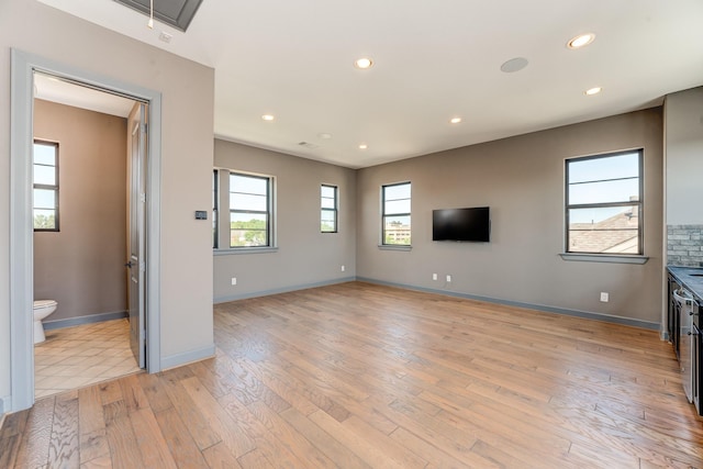 unfurnished living room with light hardwood / wood-style floors