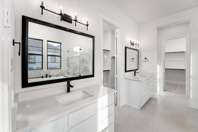 bathroom with vanity, a shower with shower door, and tile patterned flooring