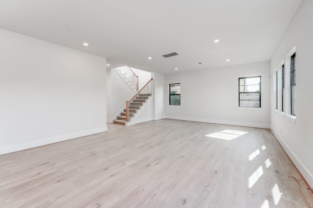 unfurnished living room with light hardwood / wood-style flooring