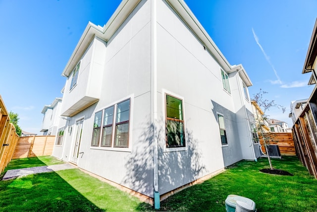 rear view of house with a yard