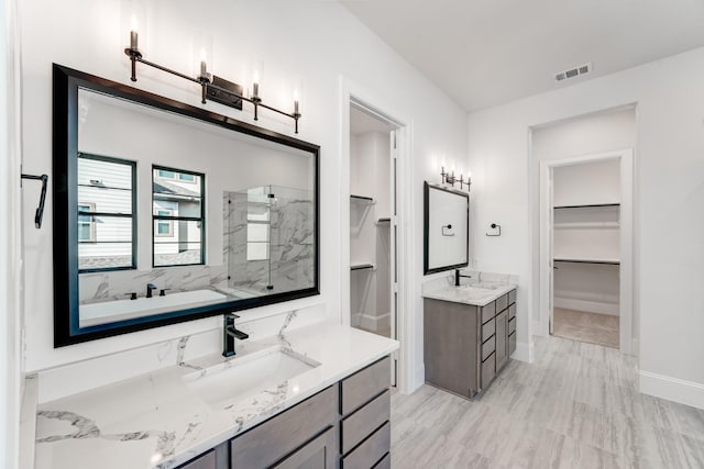 bathroom with vanity and walk in shower