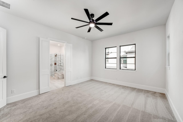 empty room with light carpet and ceiling fan