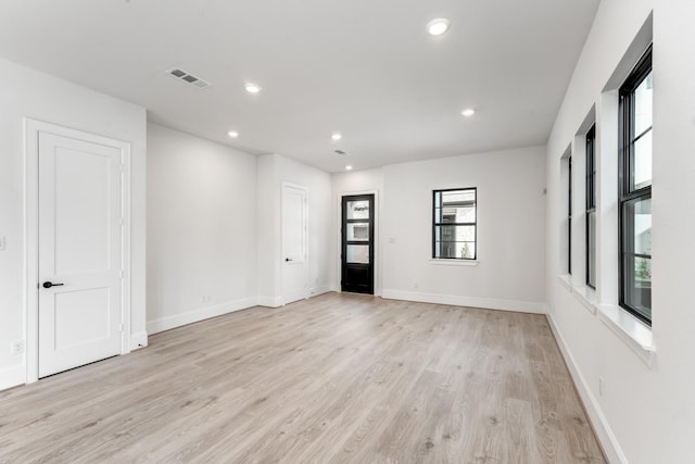 unfurnished room featuring light hardwood / wood-style flooring