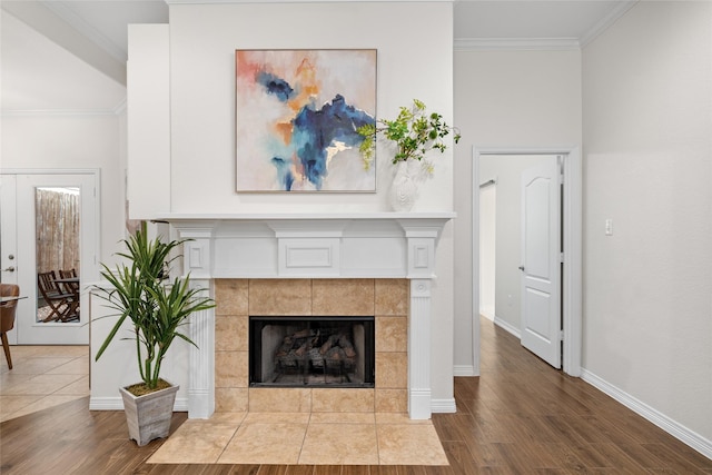 room details featuring hardwood / wood-style flooring, a fireplace, and ornamental molding