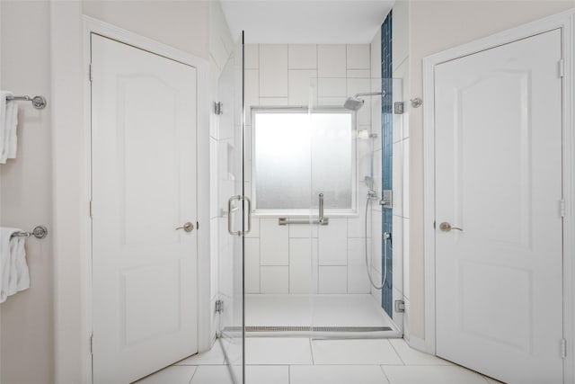 bathroom featuring tile patterned flooring and walk in shower