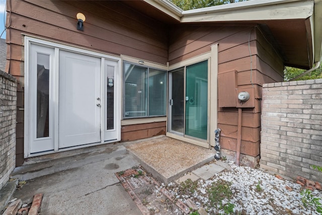 entrance to property with a patio