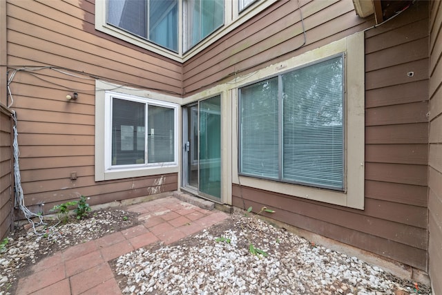 property entrance with a patio area