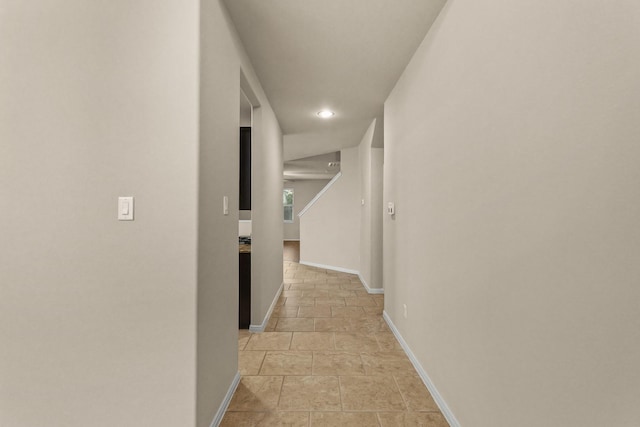 hallway featuring light tile patterned floors