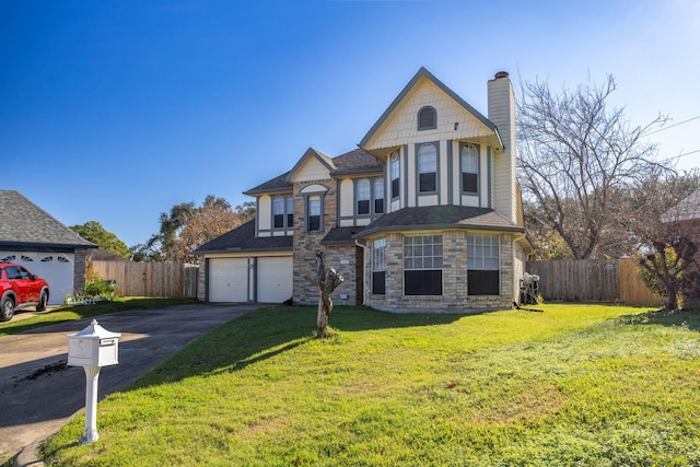 victorian house featuring a garage and a front yard