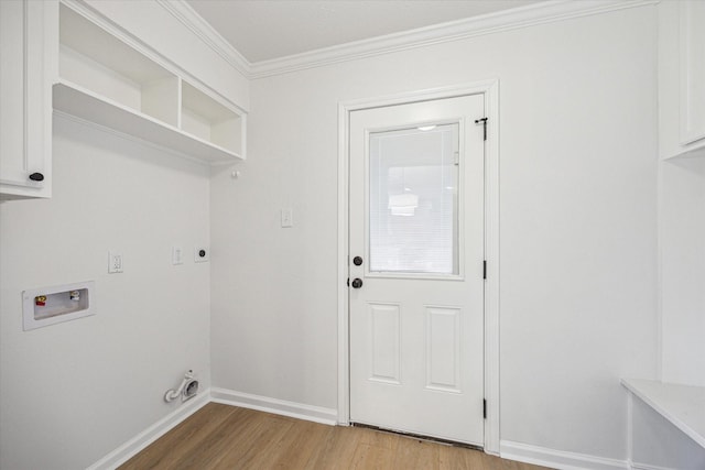 laundry room with hardwood / wood-style flooring, electric dryer hookup, cabinets, washer hookup, and ornamental molding