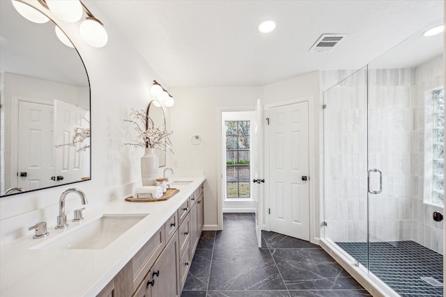 bathroom with vanity and an enclosed shower