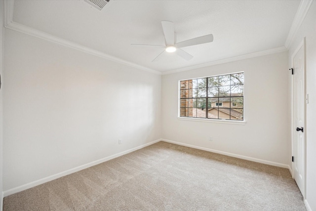 carpeted empty room with crown molding and ceiling fan