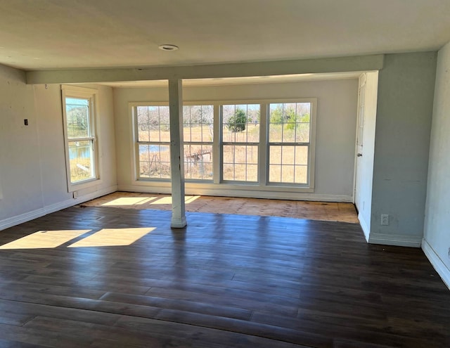 unfurnished room with dark hardwood / wood-style floors