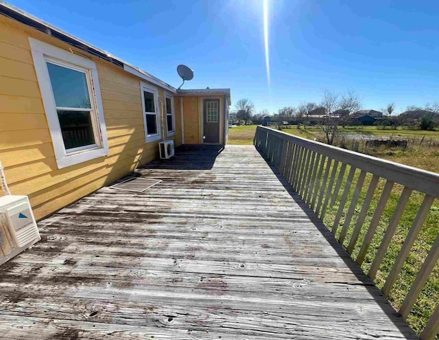 deck with a wall unit AC