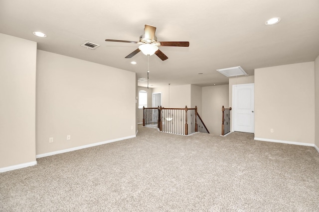 basement with carpet and ceiling fan