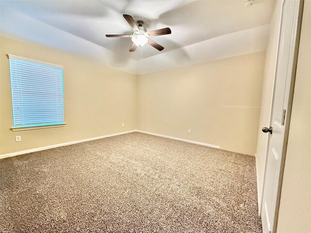 unfurnished room with lofted ceiling, ceiling fan, and carpet