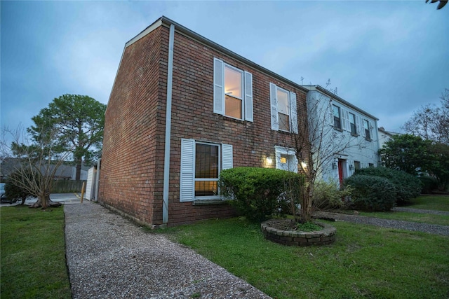 view of home's exterior with a yard