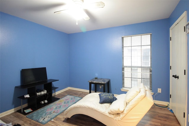 bedroom featuring dark hardwood / wood-style flooring and ceiling fan