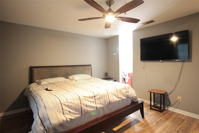 bedroom featuring wood-type flooring and ceiling fan