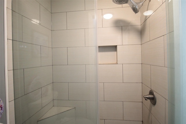 bathroom featuring tiled shower