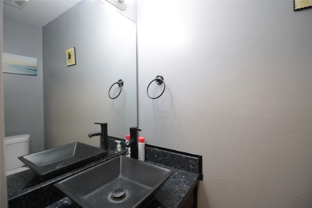 bathroom with sink and toilet