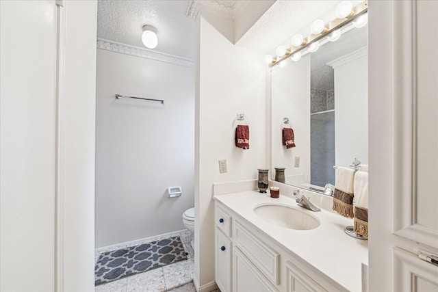 bathroom with vanity, crown molding, toilet, and a textured ceiling