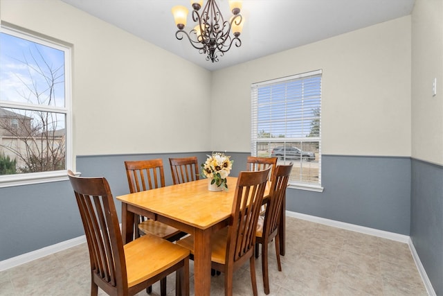 dining space with a chandelier