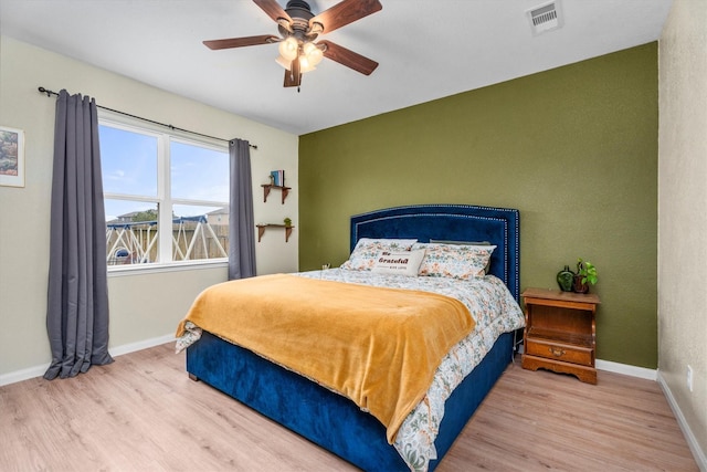 bedroom featuring ceiling fan and light wood-type flooring