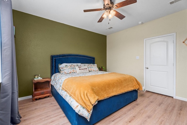 bedroom featuring wood-type flooring and ceiling fan