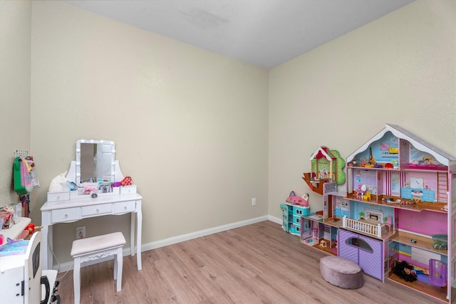 playroom with light hardwood / wood-style floors