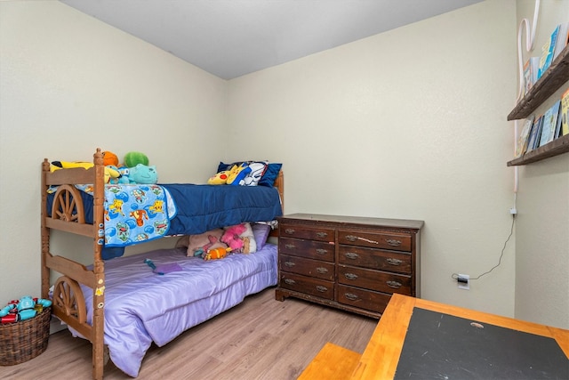 bedroom with light wood-type flooring