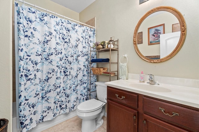 bathroom featuring a shower with curtain, vanity, toilet, and tile patterned floors