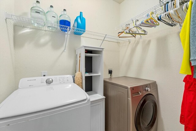 laundry area featuring independent washer and dryer