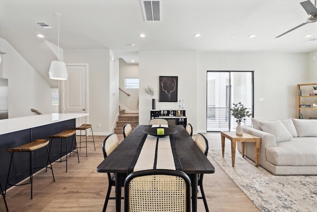 dining room featuring ceiling fan and light wood-type flooring