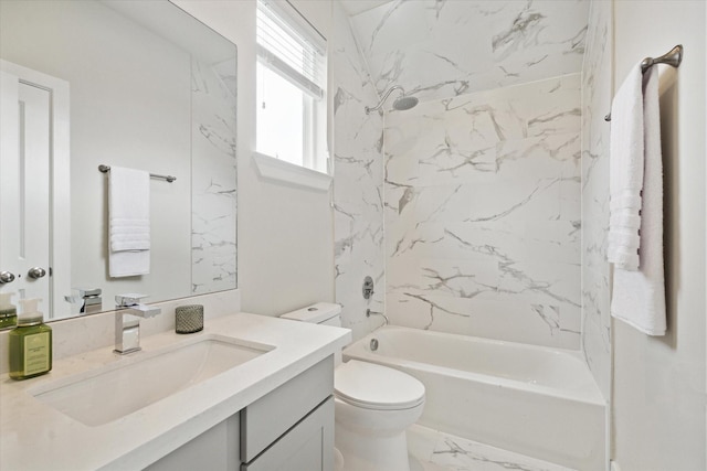 full bathroom featuring vanity, toilet, and tiled shower / bath