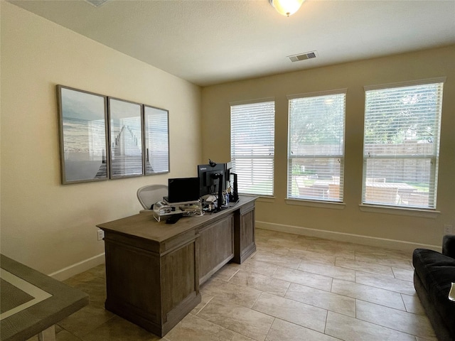 office area featuring light tile patterned floors and a wealth of natural light