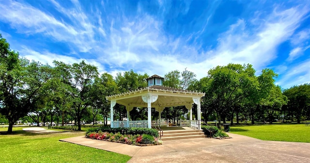 surrounding community with a gazebo and a lawn