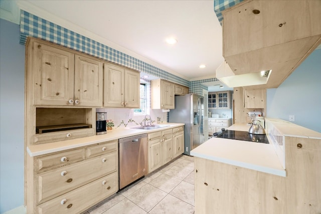 kitchen with light brown cabinetry, sink, light tile patterned floors, and appliances with stainless steel finishes