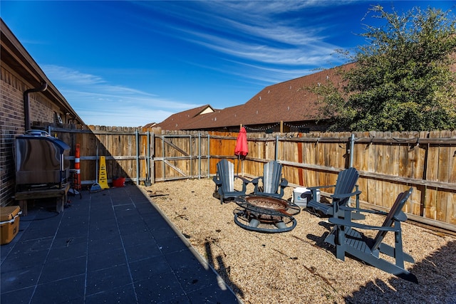 view of yard with a patio area and an outdoor fire pit